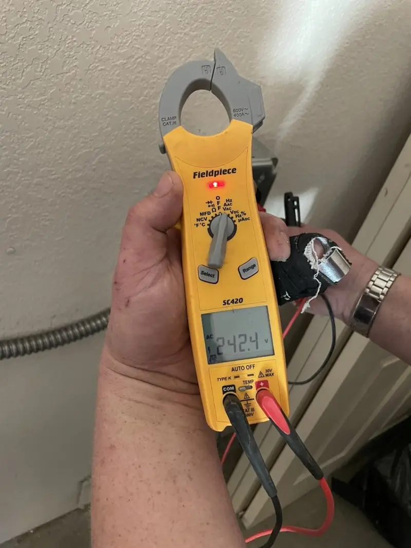 Voltage testing with clamp meter during Aluminum Wiring Replacement in Bryant